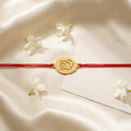Bazinco Premium Oval Ganpati Symbol Gold Finish Designer Rakhi