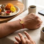 Bazinco Premium Oval Ganpati Symbol Gold Finish Designer Rakhi