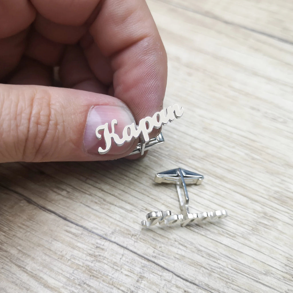 engraved silver cufflinks close up
groom personalized cuff links
men’s custom silver cufflinks
luxury name engraved cufflinks
handmade silver name cufflinks
wedding cufflinks for groom
custom cuff links with name
silver initial cufflinks for men
formal men’s silver cufflinks
personalized groom accessories
anniversary gift silver cufflinks